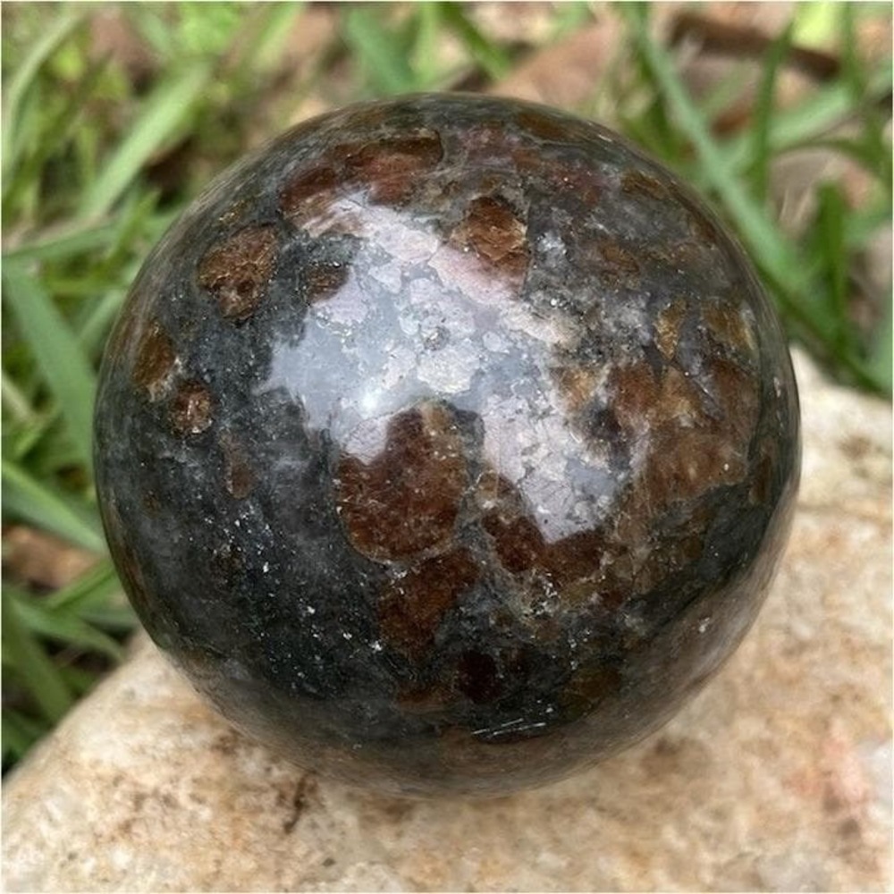 Polished Garnet Spessartine Healing Sphere Mineral Display